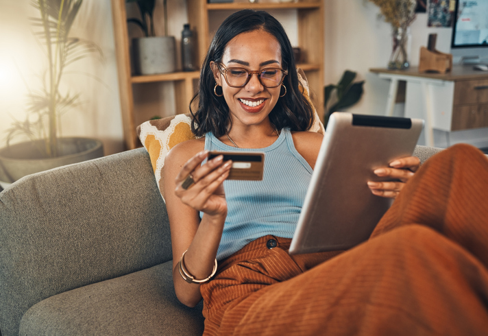 Woman looking at credit card