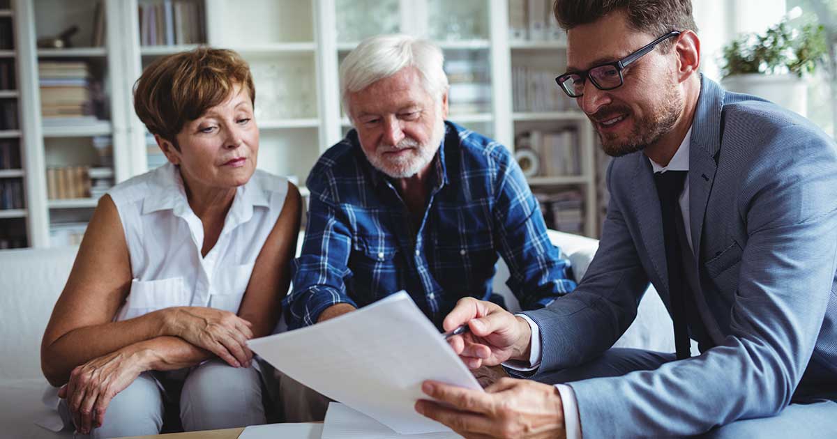 Two People Discuss Retirement with Financial Advisor