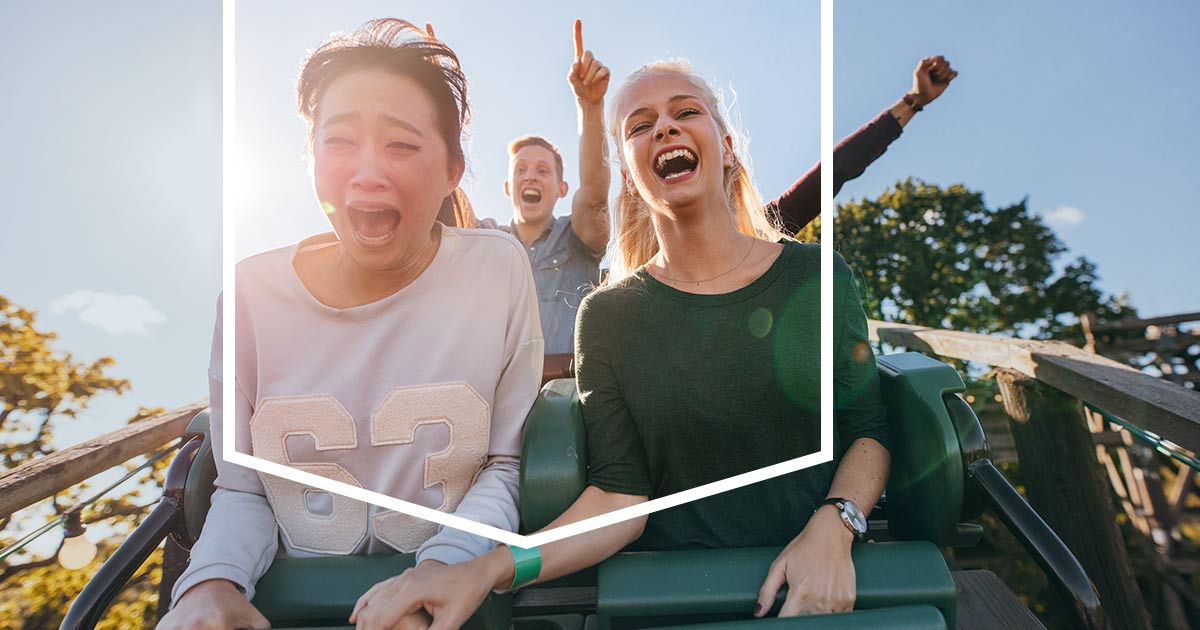 People Riding a Roller Coaster