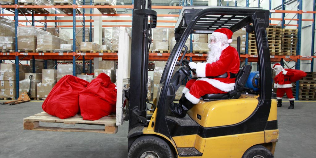 Santa moving supplies with a forklift