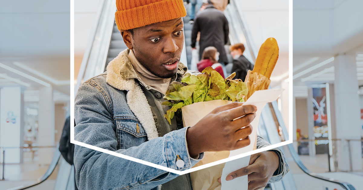 Shopper Looking at Grocery Store Bill