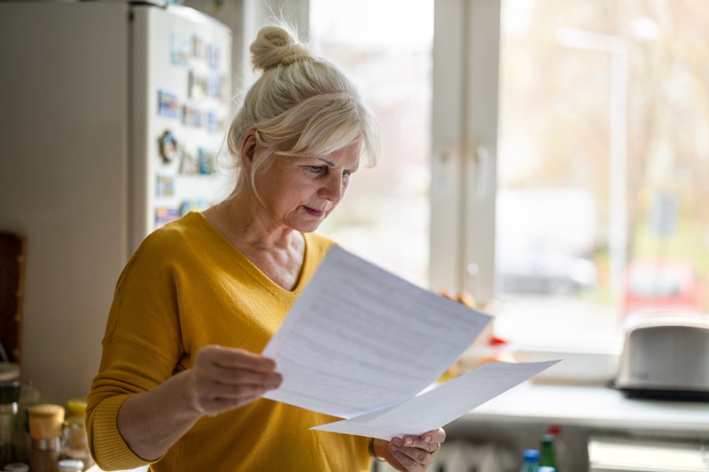 Senior woman looking at documents