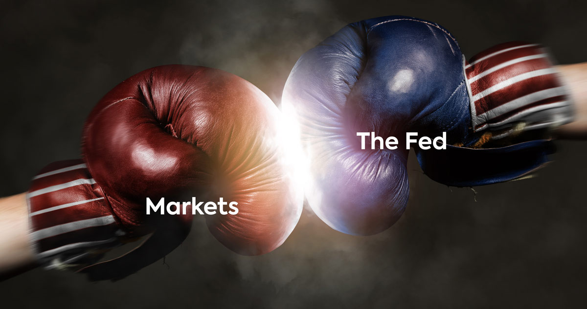 Boxing Gloves symbolizing The Markets and Fed