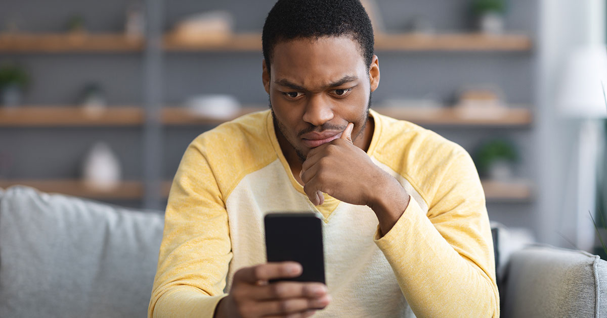 Man Checking Caller ID