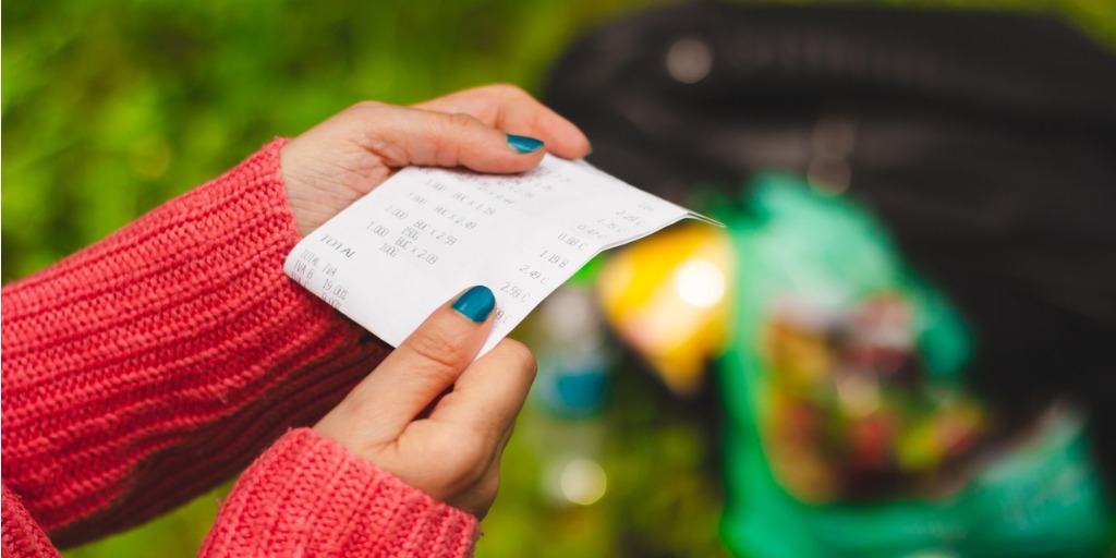 Woman reading a receipt