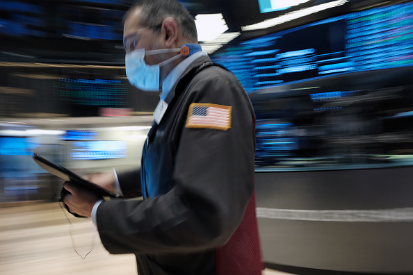 Guy walking through wall street