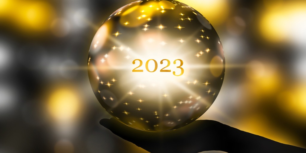 fortune telling 2023 with a crystal ball in a hand with