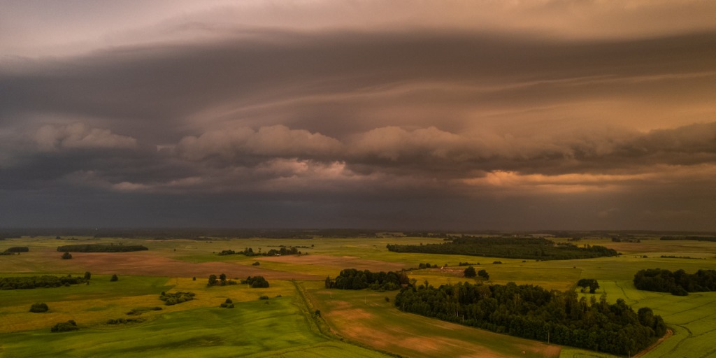 Panorama of fields before the storm