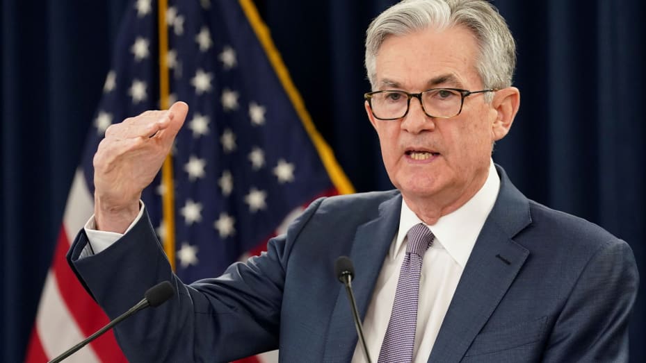 Fed Chair, Jerome Powell, with his hand gesture showing