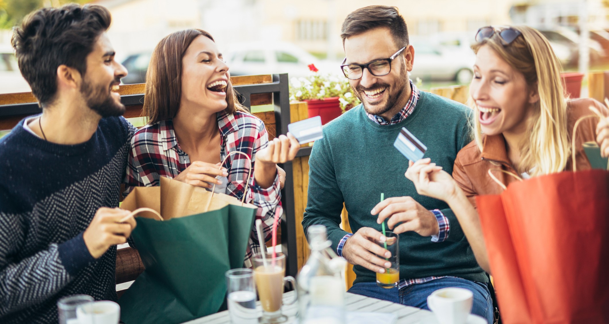 Group of four friends having fun a coffee together afte