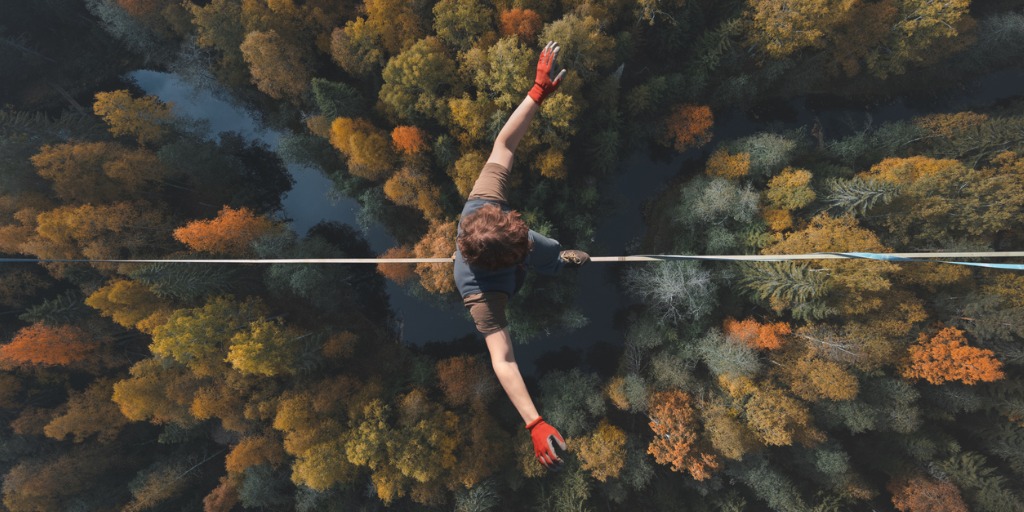 A breathtaking view of a tightrope walker walking along