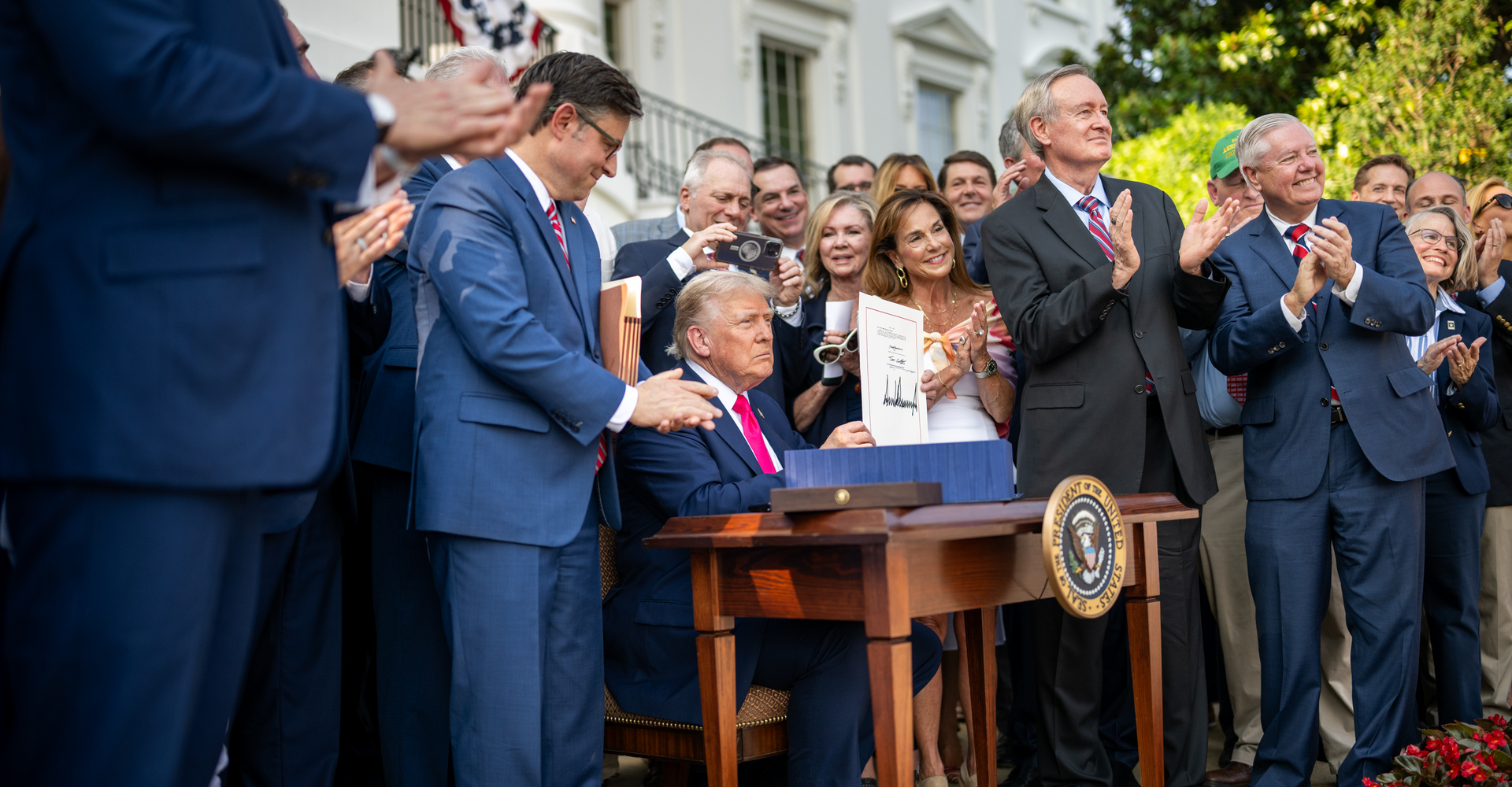 Donald Trump signs the One Big Beautiful Bill surrounde