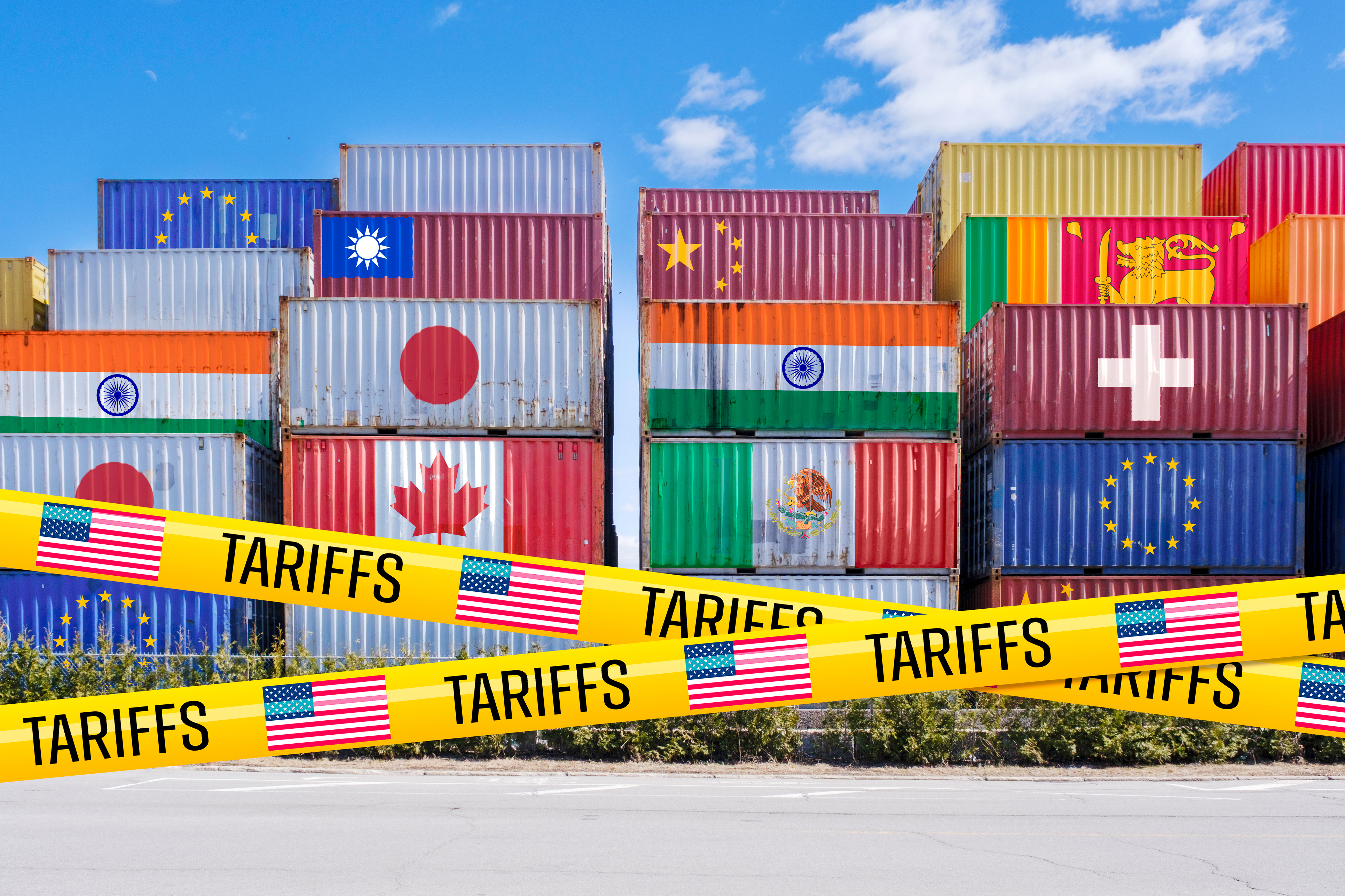 Shipping containers adorned with global flags, barricad