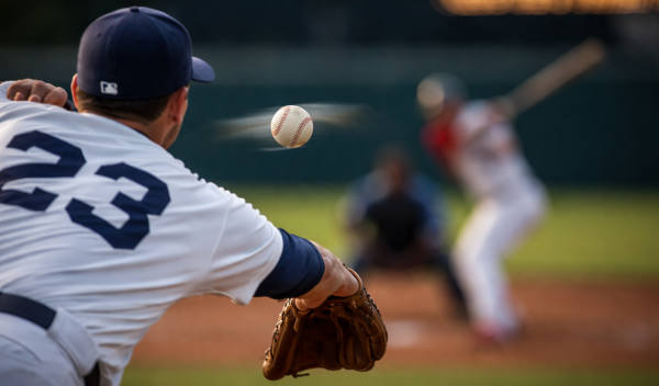 A look behind a baseball pitcher throwing a curveball