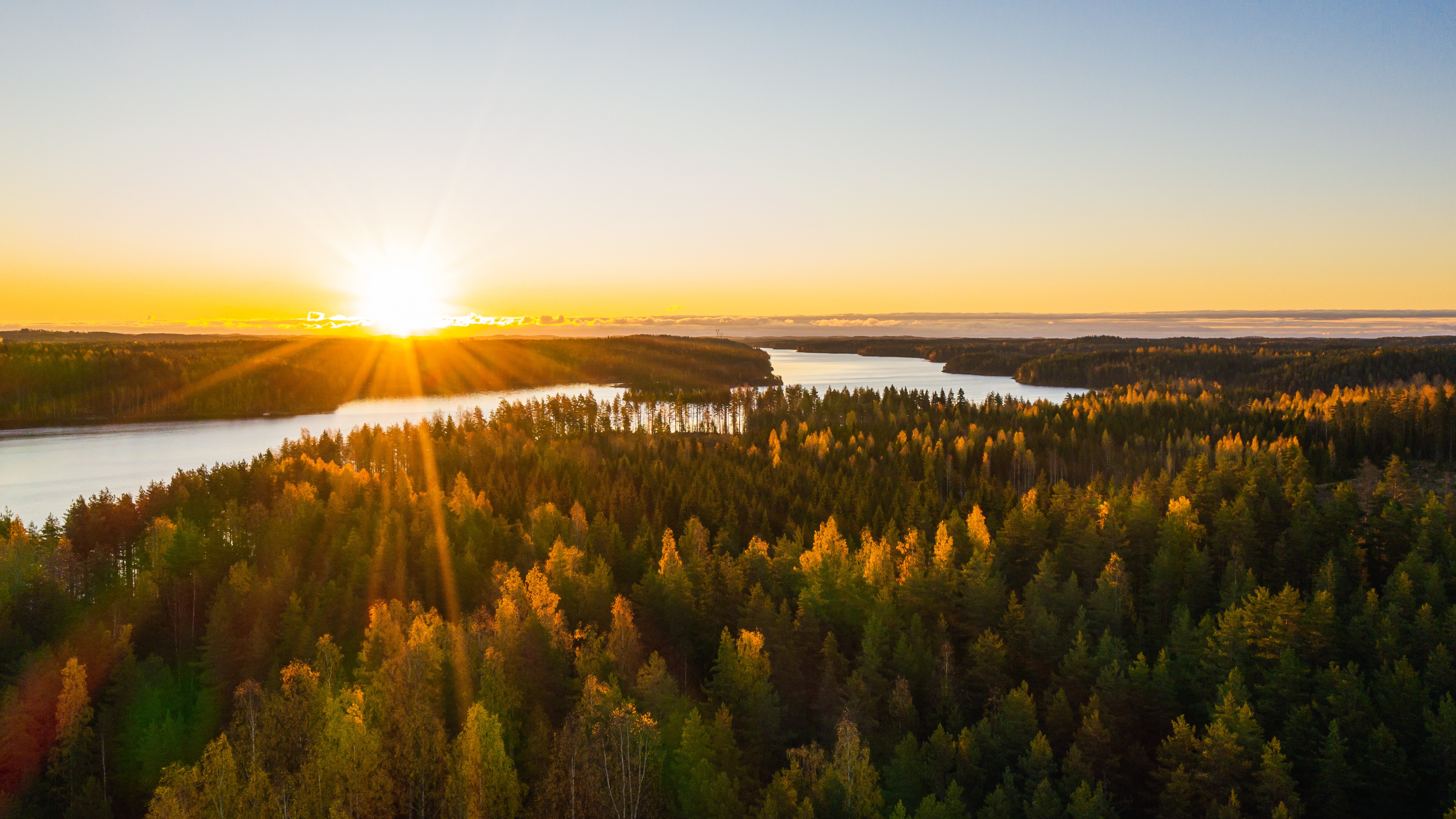 Sun rising over a riverbed.