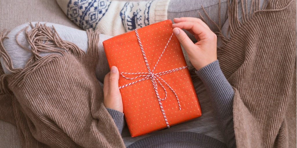 Woman unwrapping a gift